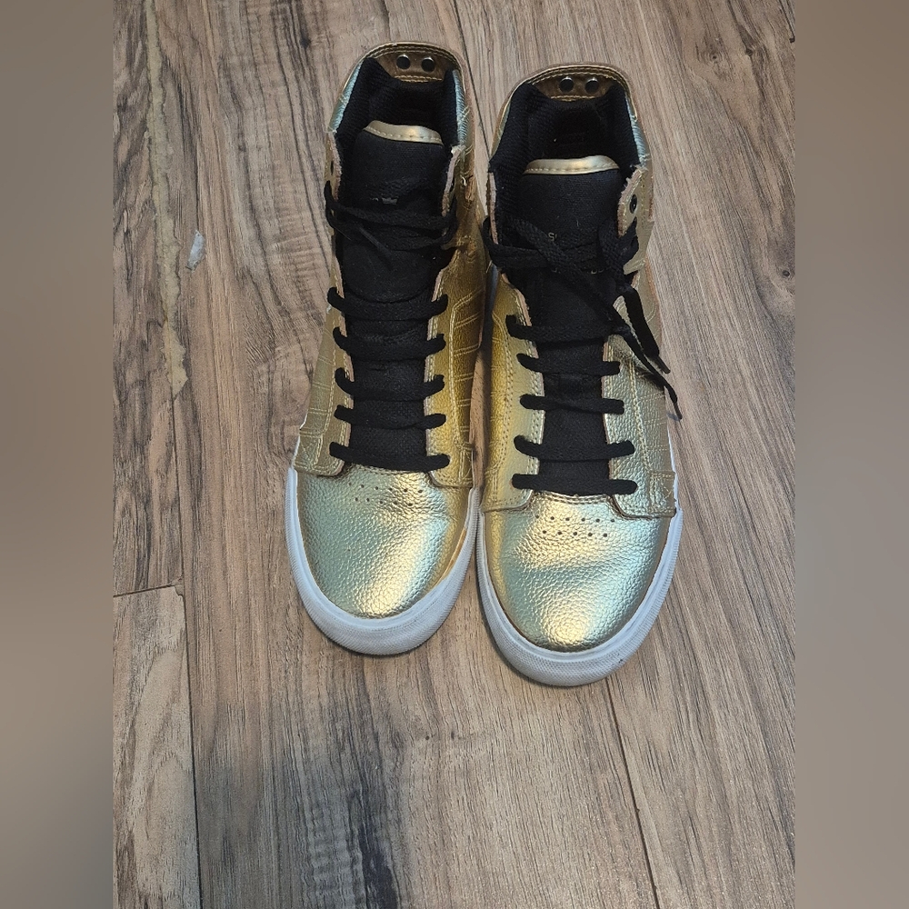 Supra Gold and Black Sneakers with Metallic Flair